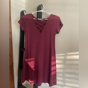 Burgundy t-shirt dress with crisscrossed detailing in the front